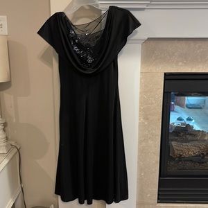 Black semi formal dress with side zipper.Lace inset with sequins in the neckline